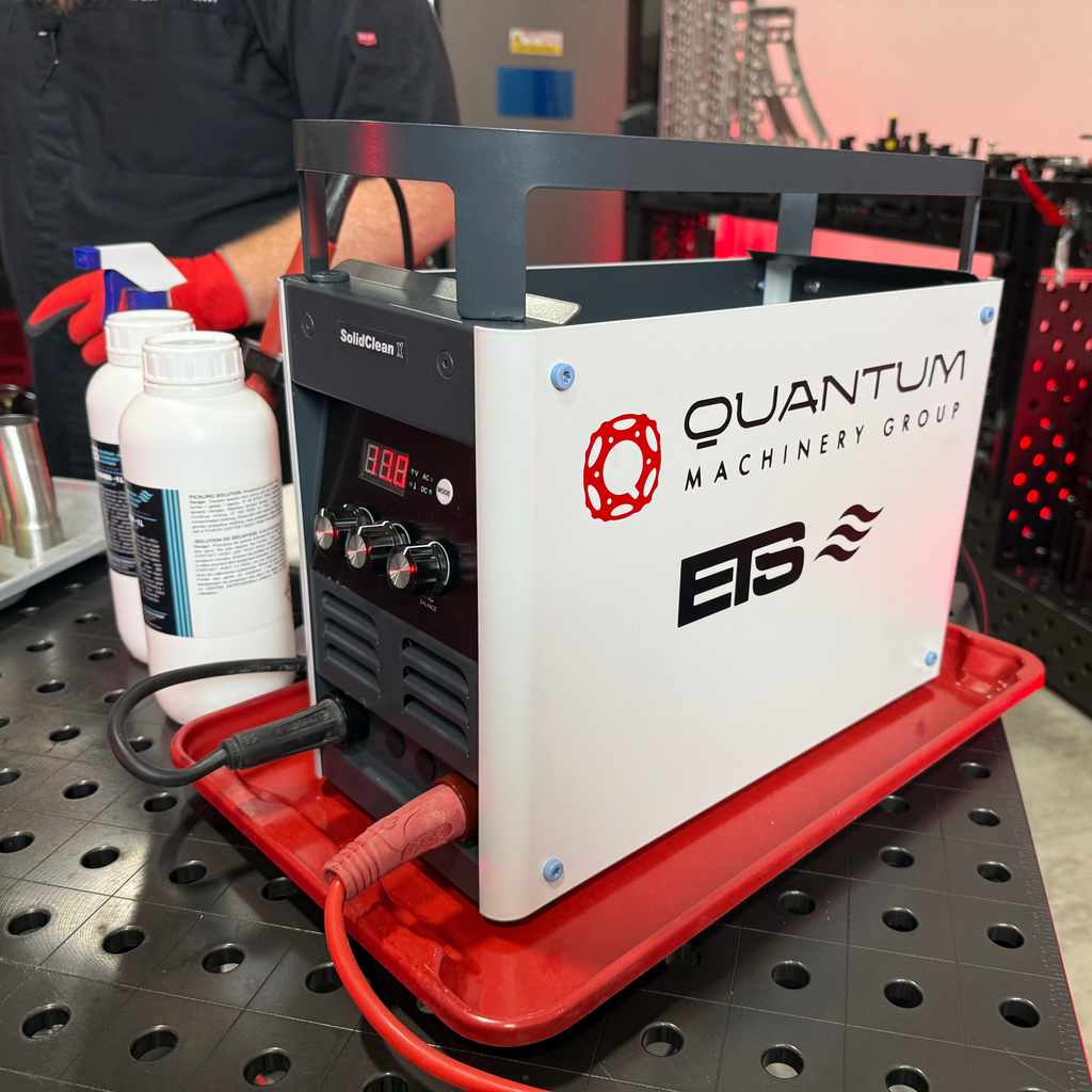 Quantum Machinery Group machine on a workbench with tools in the background