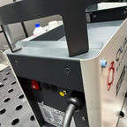 Close-up of a machine with visible branding on a metallic surface